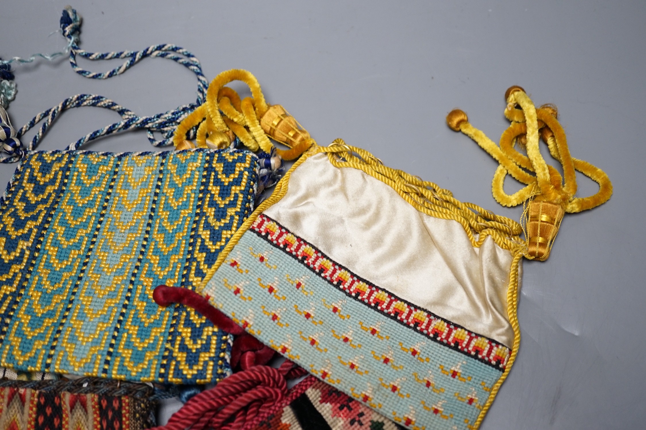 Ten 19th century embroidered and woolworked bible bags, largest 18 x 16cm